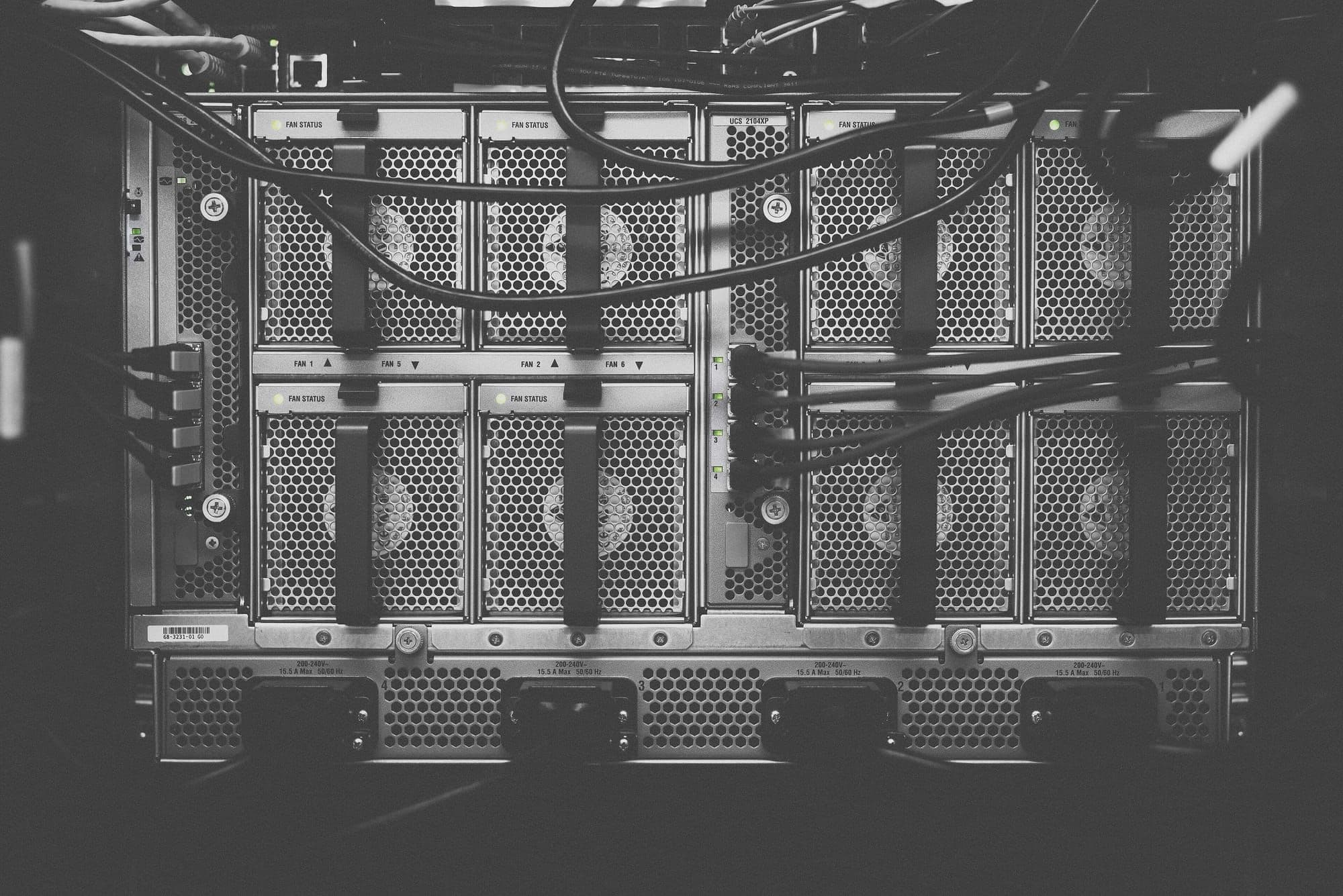 Rack of servers with cables in a data room